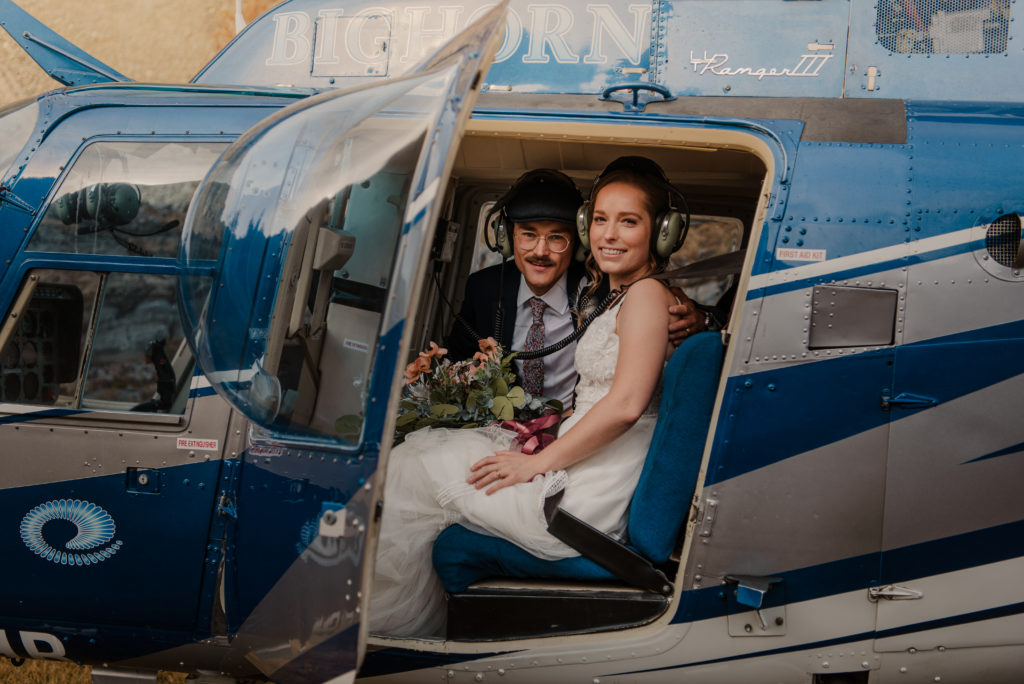 bride and groom getting into helicopter