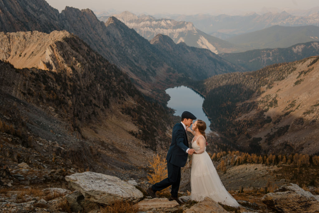 Cranbrook helicopter elopement in the fall with a lake and larch trees in the mountains