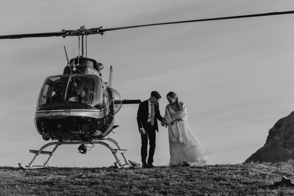 black and white bride and groom portrait with helicopter