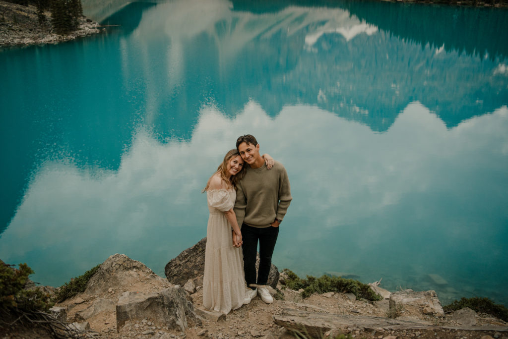 moraine lake reflection with couple during engagement session