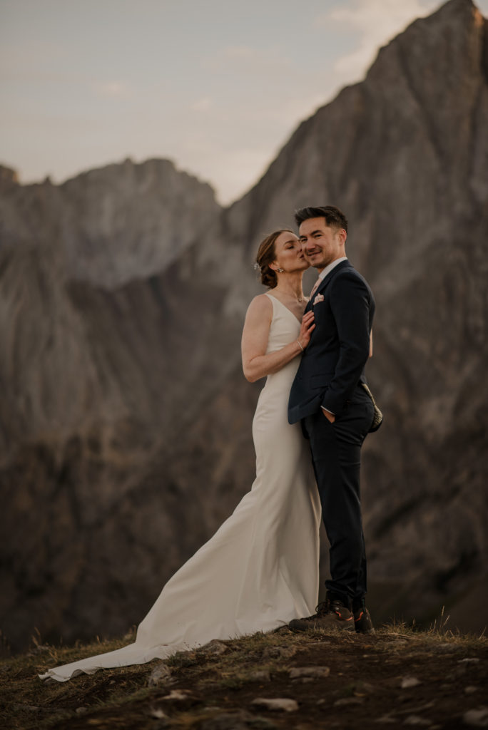 Sunrise hiking elopement in Kananaskis Alberta with soft light and epic mountain backdrops. 