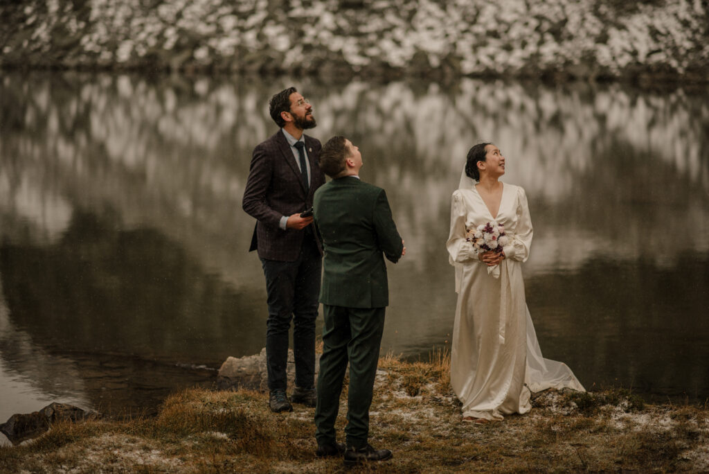 wedding ceremony by a mountain lake in banff