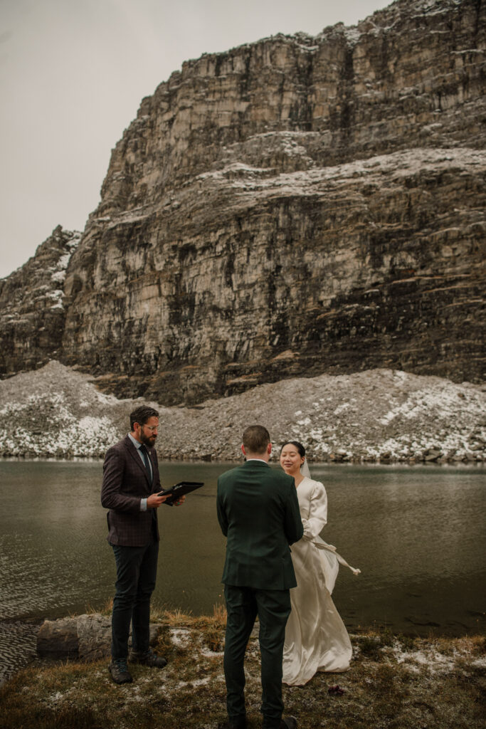 wedding couple with mountains in the background Banff