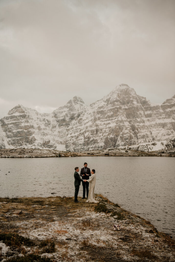 wedding couple with mountains in the background Banff