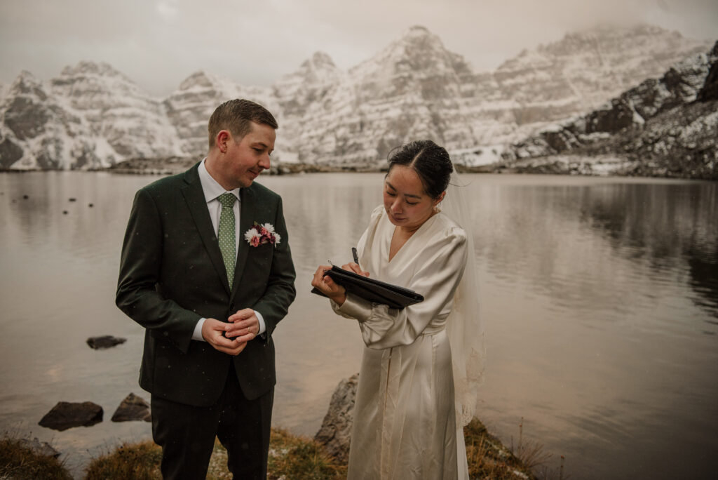 wedding ceremony by a mountain lake in banff