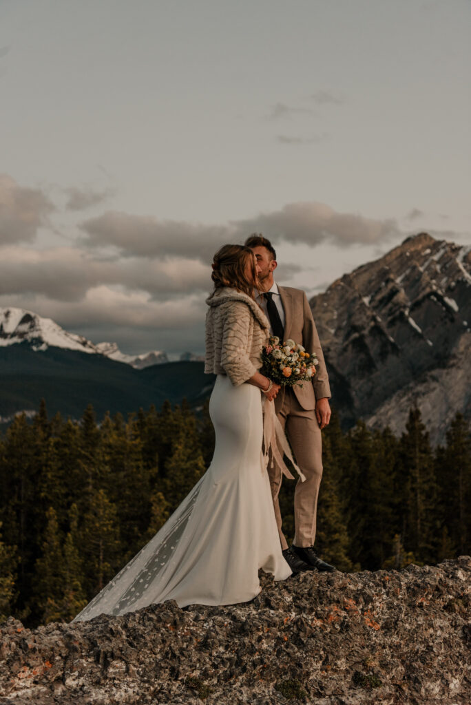 bride and groom on a mountain for hiking elopement