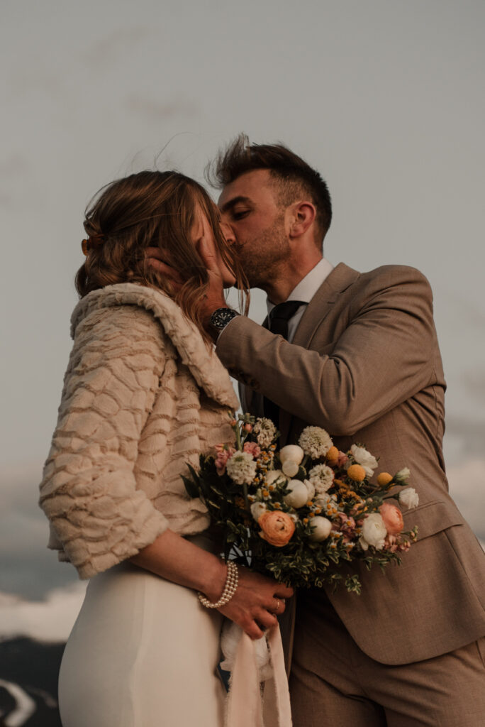 bride and groom on a mountain for hiking elopement