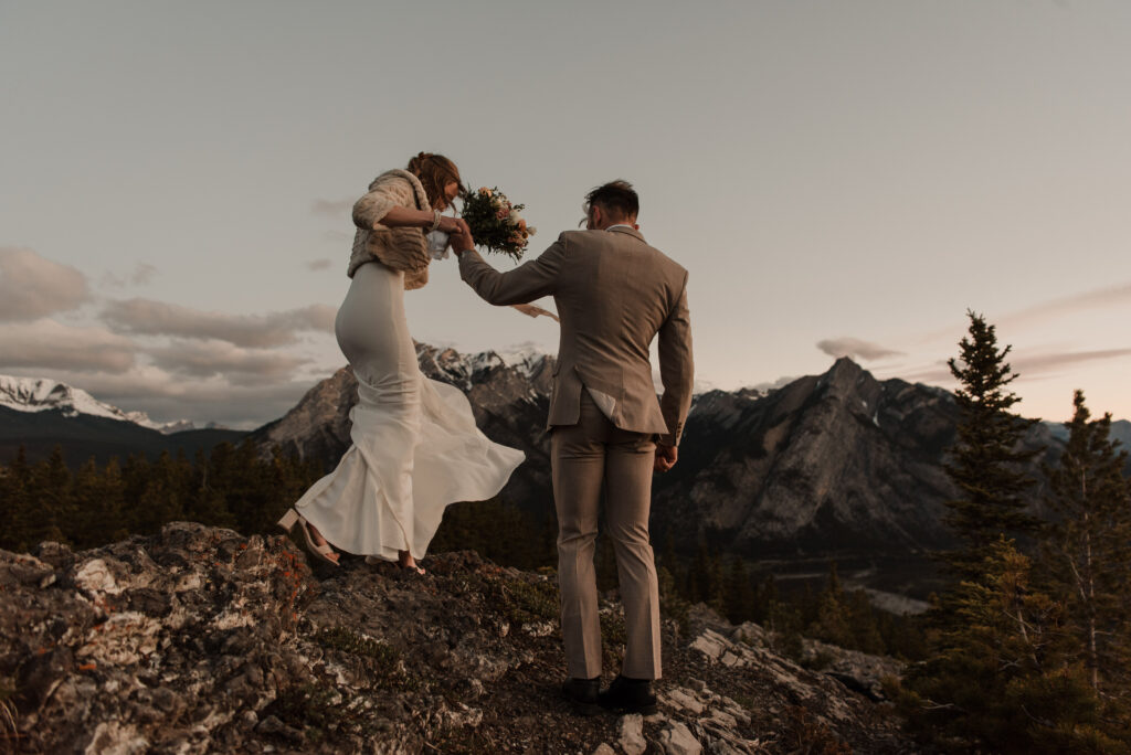 bride and groom on a mountain for hiking elopement