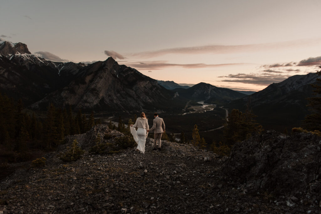 bride and groom on a mountain for hiking elopement