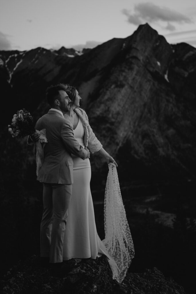 bride and groom on a mountain for hiking elopement