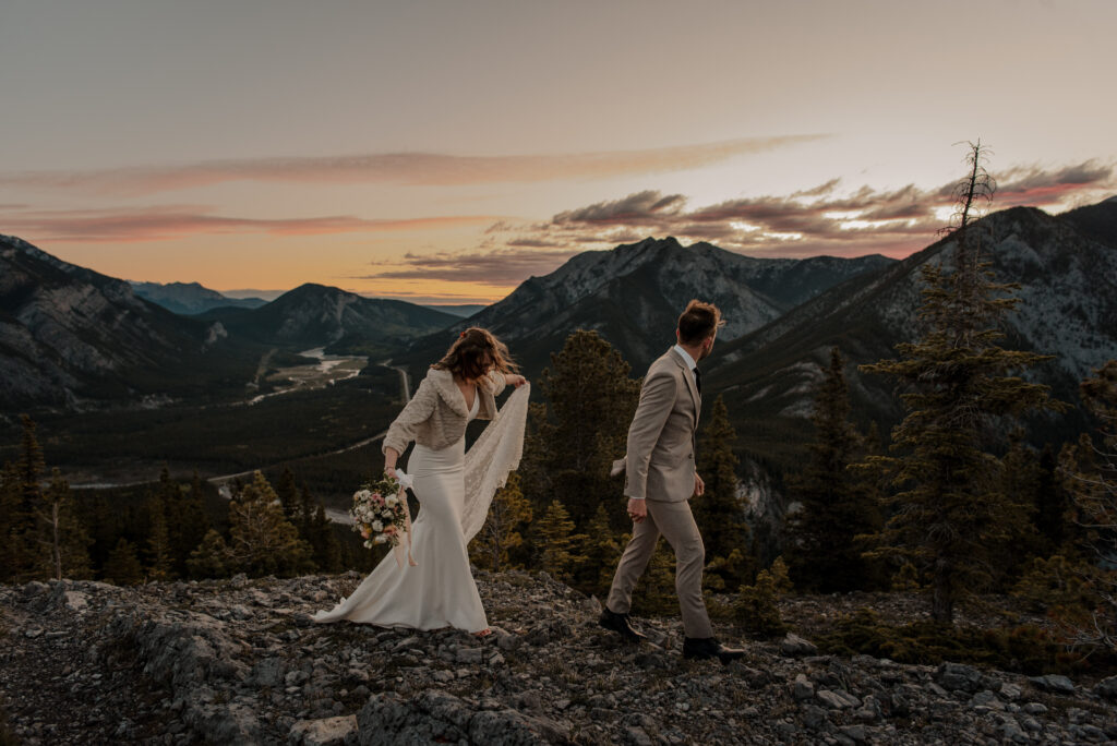 bride and groom on a mountain for hiking elopement