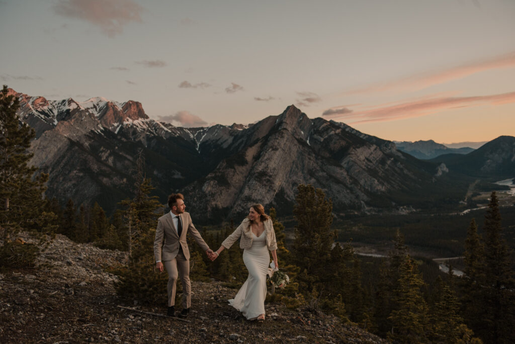 bride and groom on a mountain for hiking elopement