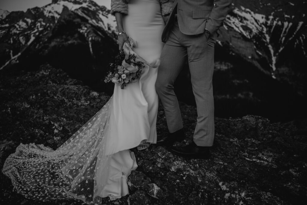 bride and groom on a mountain for hiking elopement