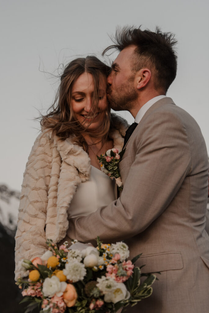 bride and groom on a mountain for hiking elopement