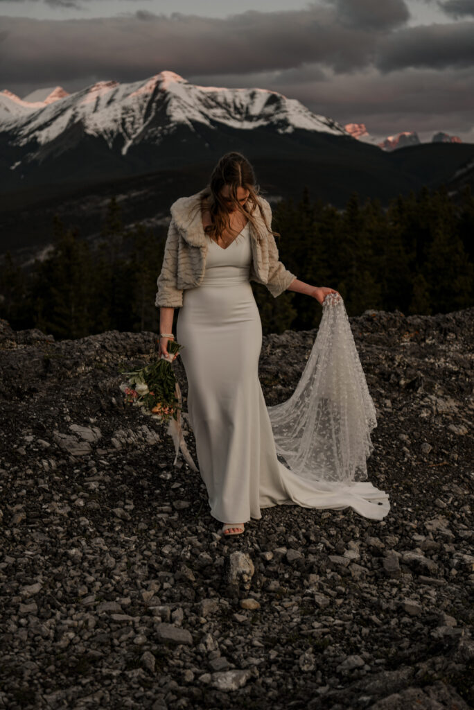 bride and groom on a mountain for hiking elopement