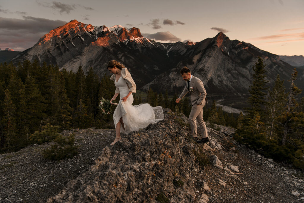 bride and groom on a mountain for hiking elopement