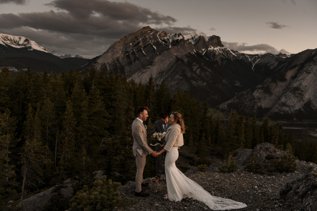 bride and groom on a mountain for hiking elopement