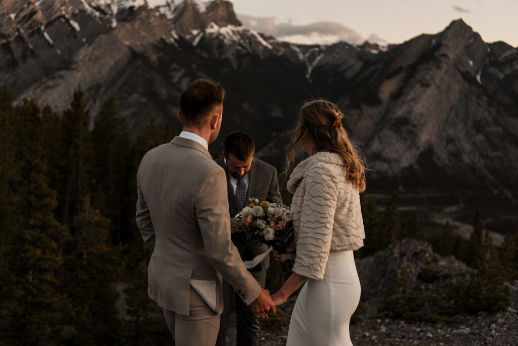 bride and groom mountain top sunrise elopement ceremony