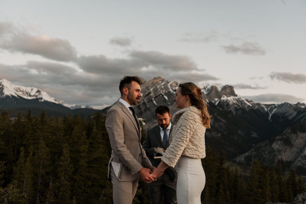 bride and groom mountain top sunrise elopement ceremony