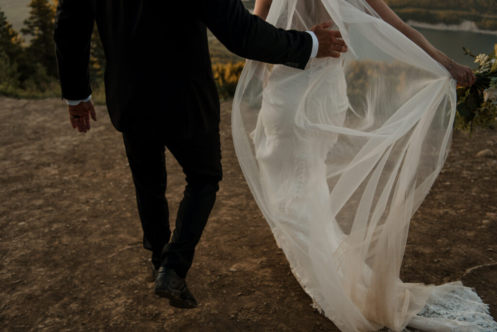 bride and groom sunrise hiking elopement in Alberta