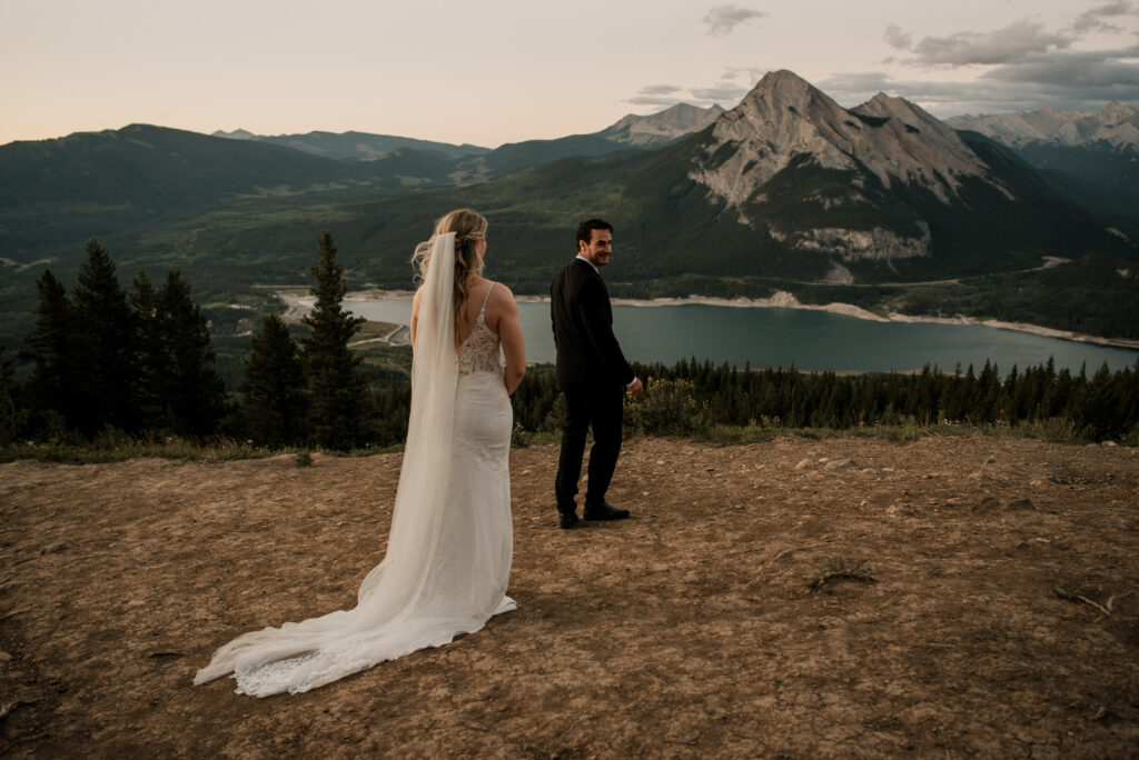 first look on a mountain at sunrise for an elopement