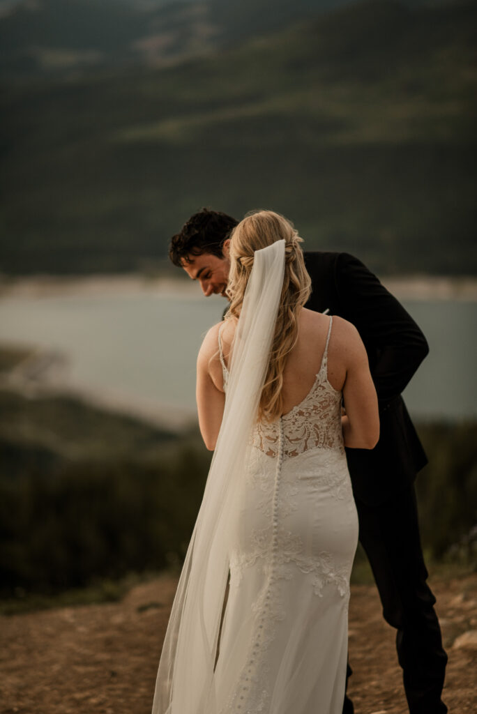 first look on a mountain at sunrise for an elopement