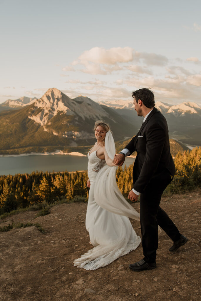 bride and groom sunrise hiking elopement in Alberta