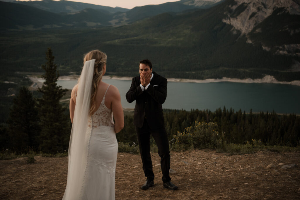 first look on a mountain at sunrise for an elopement