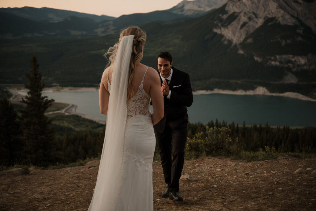 first look on a mountain at sunrise for an elopement