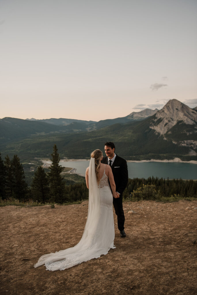 first look on a mountain at sunrise for an elopement